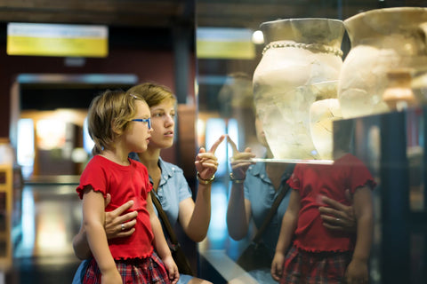 Child and parent visiting museum