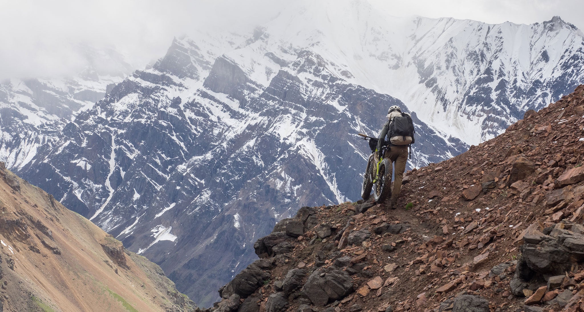 Ultralight bikepacker on a mountain
