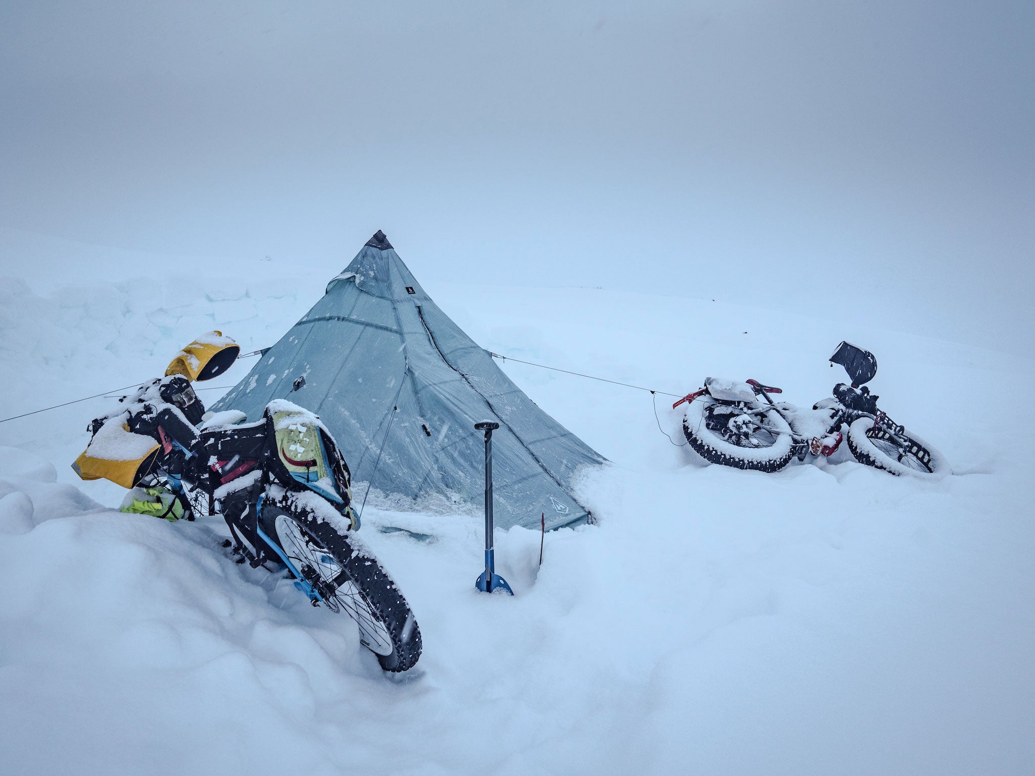 Ultralight tent surrounded by fresh snow