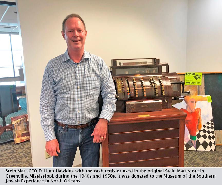 Stein Mart CEO D. Hunt Hawkins with the cash register used in the original Stein Mart store in Greenville, Mississippi, during the 1940s and 1950s. It was donated to the Museum of the Southern Jewish Experience in North Orleans.
