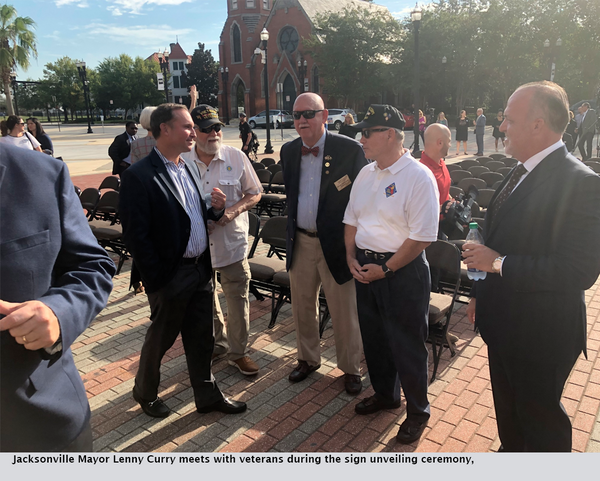 Jacksonville Mayor Lenny Curry meets with veterans during the sign unveiling ceremony,