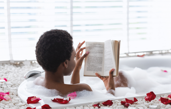 The Morphbag by GSK | Blog | 5 Tips To Boost Your Mental Health | Woman in a bubble bath reading a book