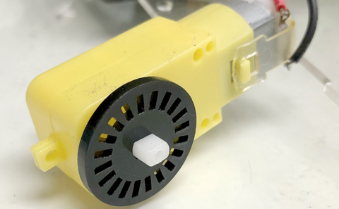 connecting the slotted disc on to the plastic gear motor. 