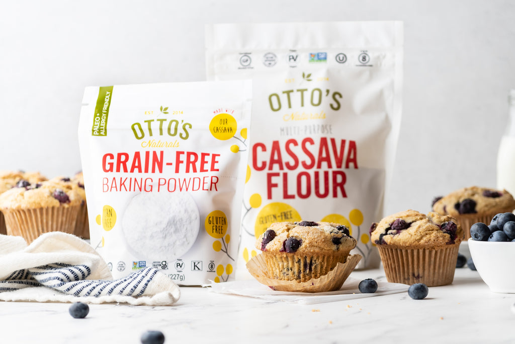 blueberry muffins on counter with Otto's Naturals Grain-free baking powder bag and Cassava Flour bag