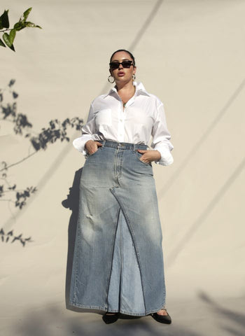 Model in white shirt and denim skirt