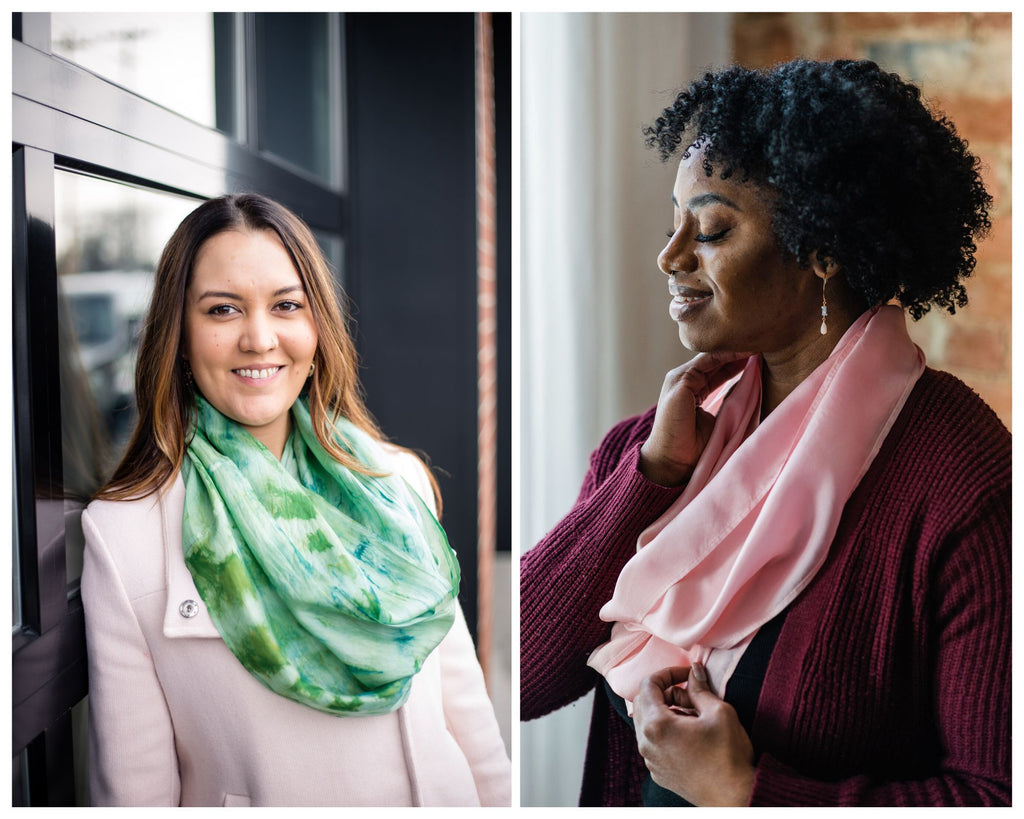 Collage of women wearing silk infinity scarves. One is an Arab American with long dark hair and highlights, wearing a green silk infinity scarf and a cream colored coat.  The other is a Black woman with short coiled hair framing her face in profile, wearing a dark pink sweater and a light pink silk infinity scarf.