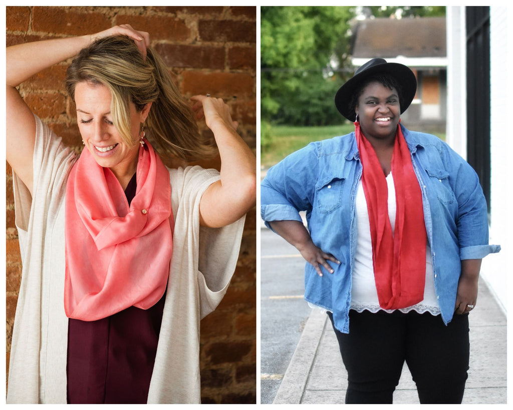 A collage of photos of women wearing silk infinity scarves.  One is of a white woman pulling her long blond hair into a pony tail while wearing a pink silk infinity scarf with a tan short sleeve sweater and purple top. The other is a plus size Black woman with short hair in small locs, wearing a bright red extra large silk infinity scarf with a black fedora, denim shirt, white tank and black pants.