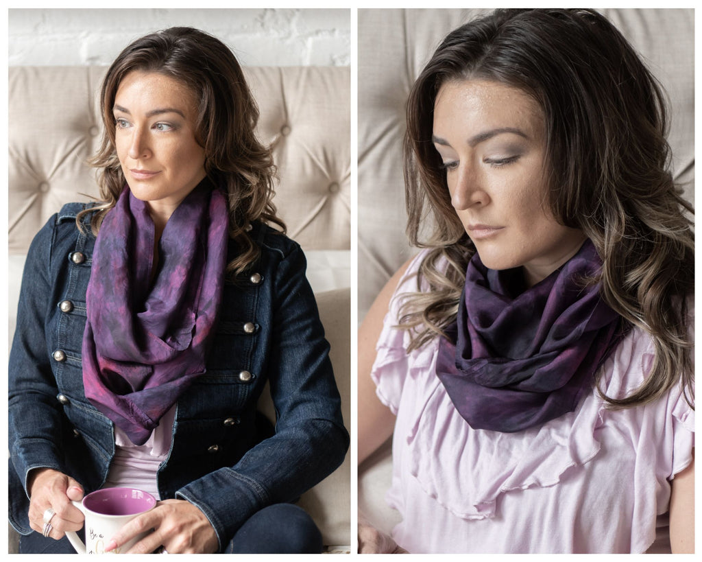 Two photos of a white woman with wavy brown hair.  In one photo she's wearing a blue jacket with a purple silk infinity scarf wrapped twice, loosely around her neck.  In the other photo she's wearing a sleeveless light purple top with the infinity scarf wrapped three times, closely, around her neck.