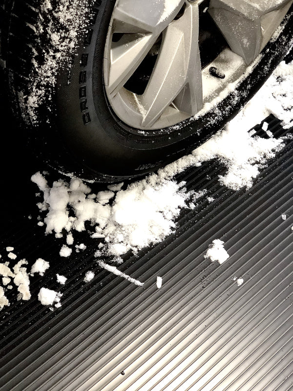 Tire and snow on Midnight Black Ribbed texture vinyl flooring