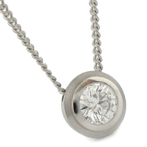 Diamond bezel set pendant in double bezel in platinum on a 1mm chain.