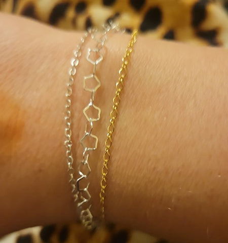 mix silver and gold bracelets on your wrist as a way to be in on the mixed metals jewelry trend