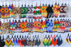 traditional mexican jewelry incorporate flower designs with glass beads