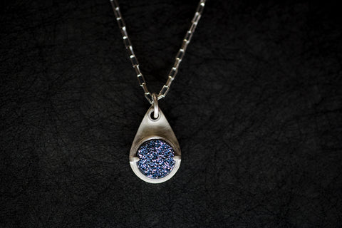 Zink Metals’ Icy Blue Druzy Necklace is a colorful gemstone necklace that is on trend for fall 2023 jewelry