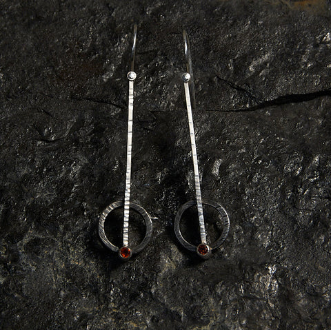 the pierced circle earrings are one way to mix metals in jewelry with combined steel and silver
