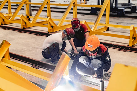 image of a welder at a construction site