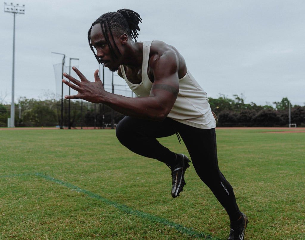 An athlete is training hard on the field.