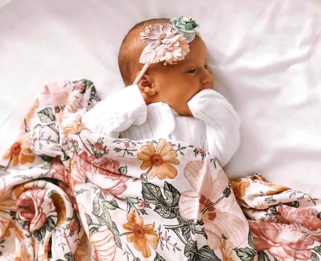 Newborn Baby in Floral Muslin Wrap