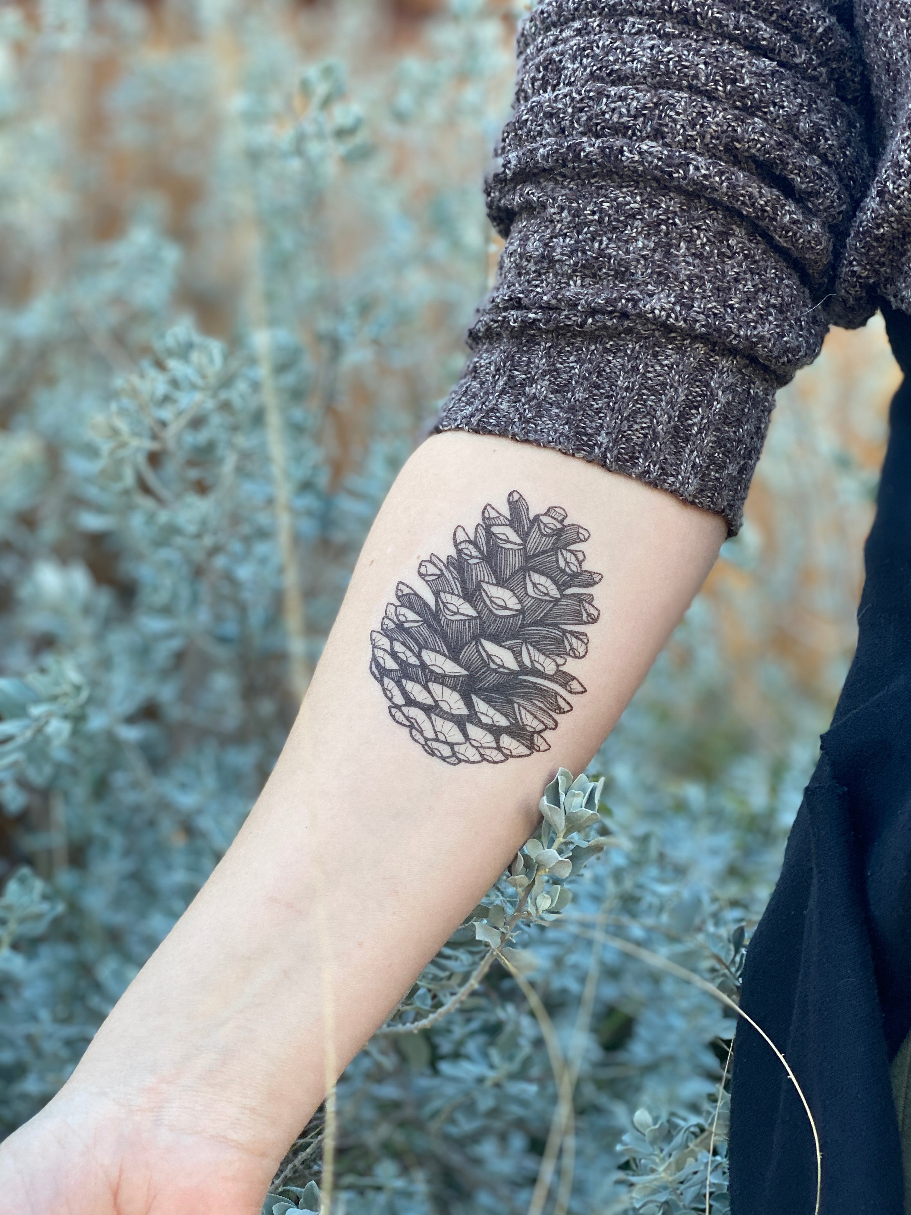 Pine cone tattoo