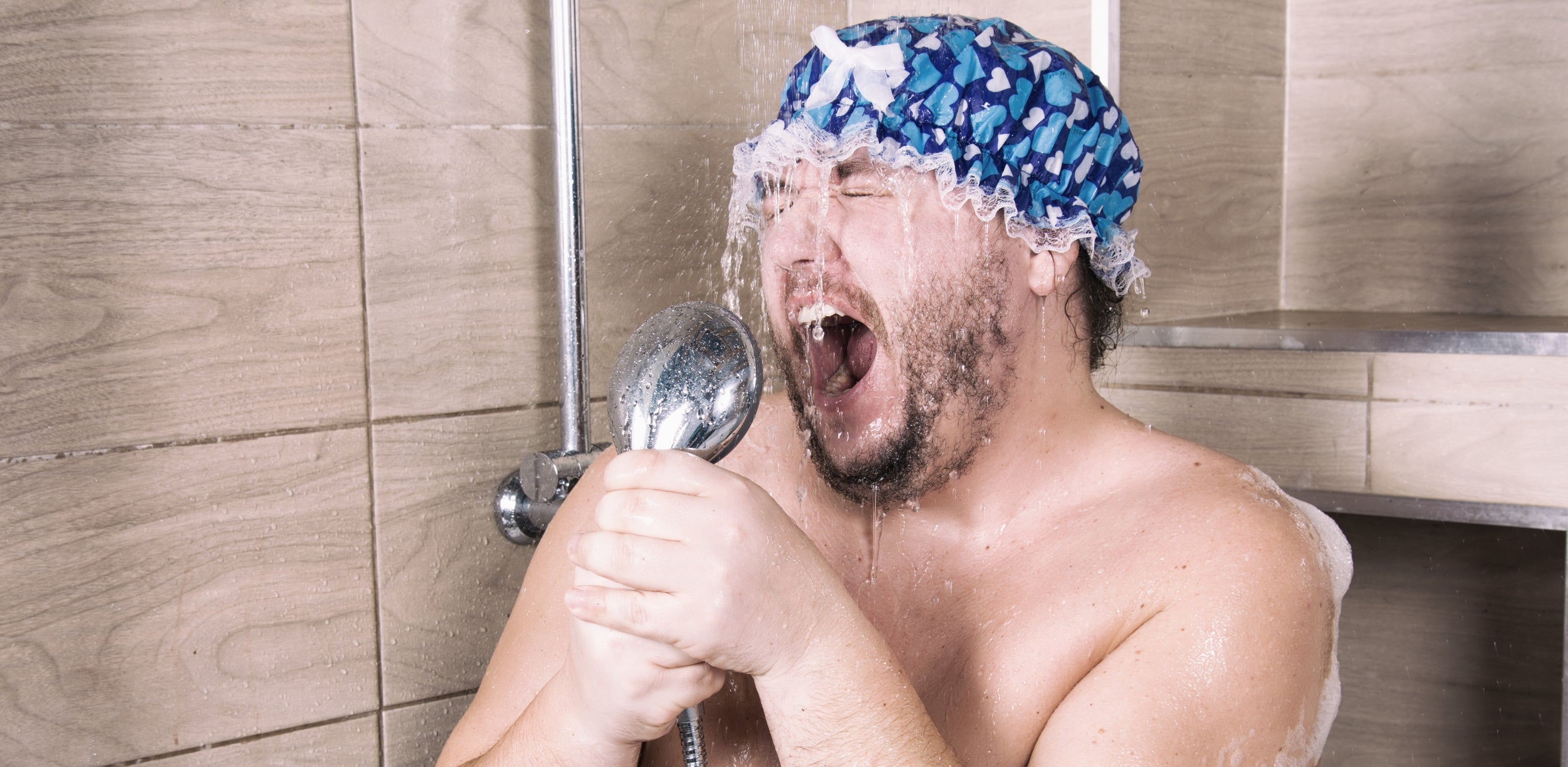 Man Shaving In Shower