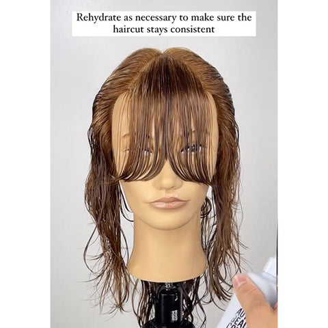 A mannequin with a freshly-cut curtain bang for the butterfly haircut tutorial.