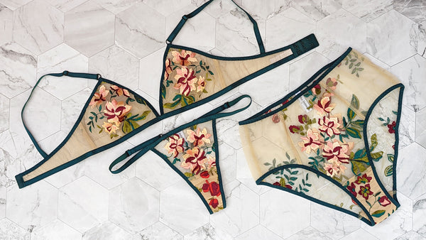 Floral lingerie and underwear set with pink flowers and green leaves