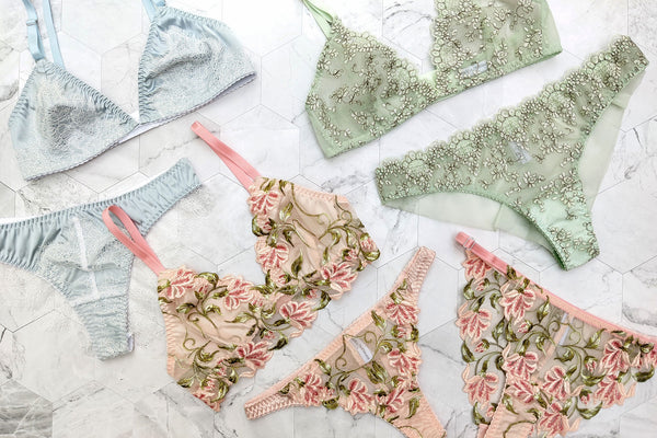 Luxury lingerie sets in pastel pink, blue, and green florals