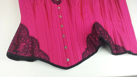 Custom fuchsia pink silk corset with black luxury lace applique trim