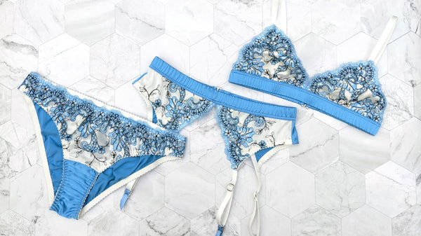 Blue silk lingerie set with a lace garter belt for weddings