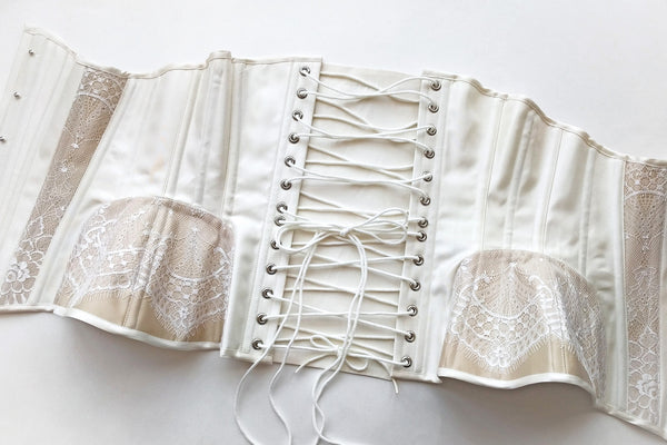 White silk corset with lace trim