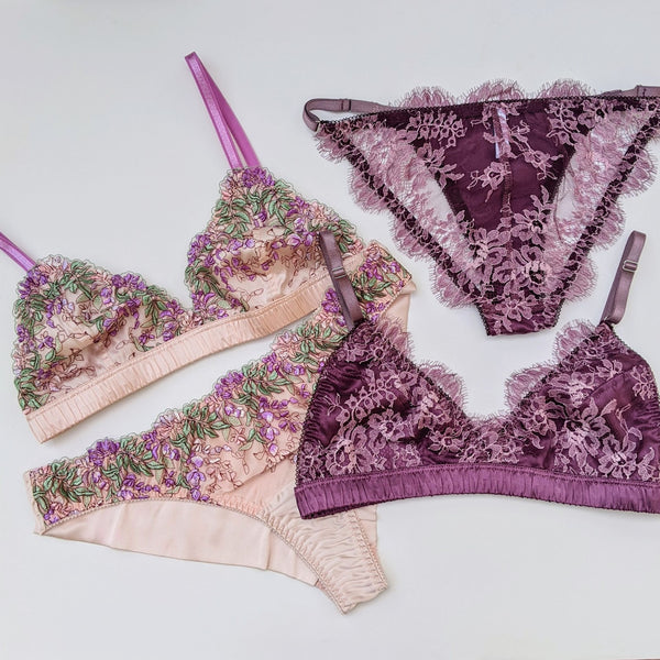 Purple lace bralette and embroidered pink bras