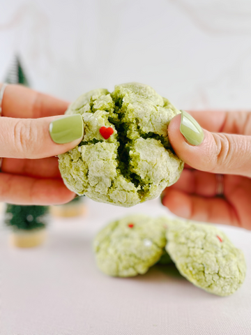 Matcha Grinch Crinkle Cookies with a tiny heart sprinkle in the center