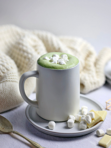 Matcha White Hot Chocolate with Marshmallows and a cozy cream blanket