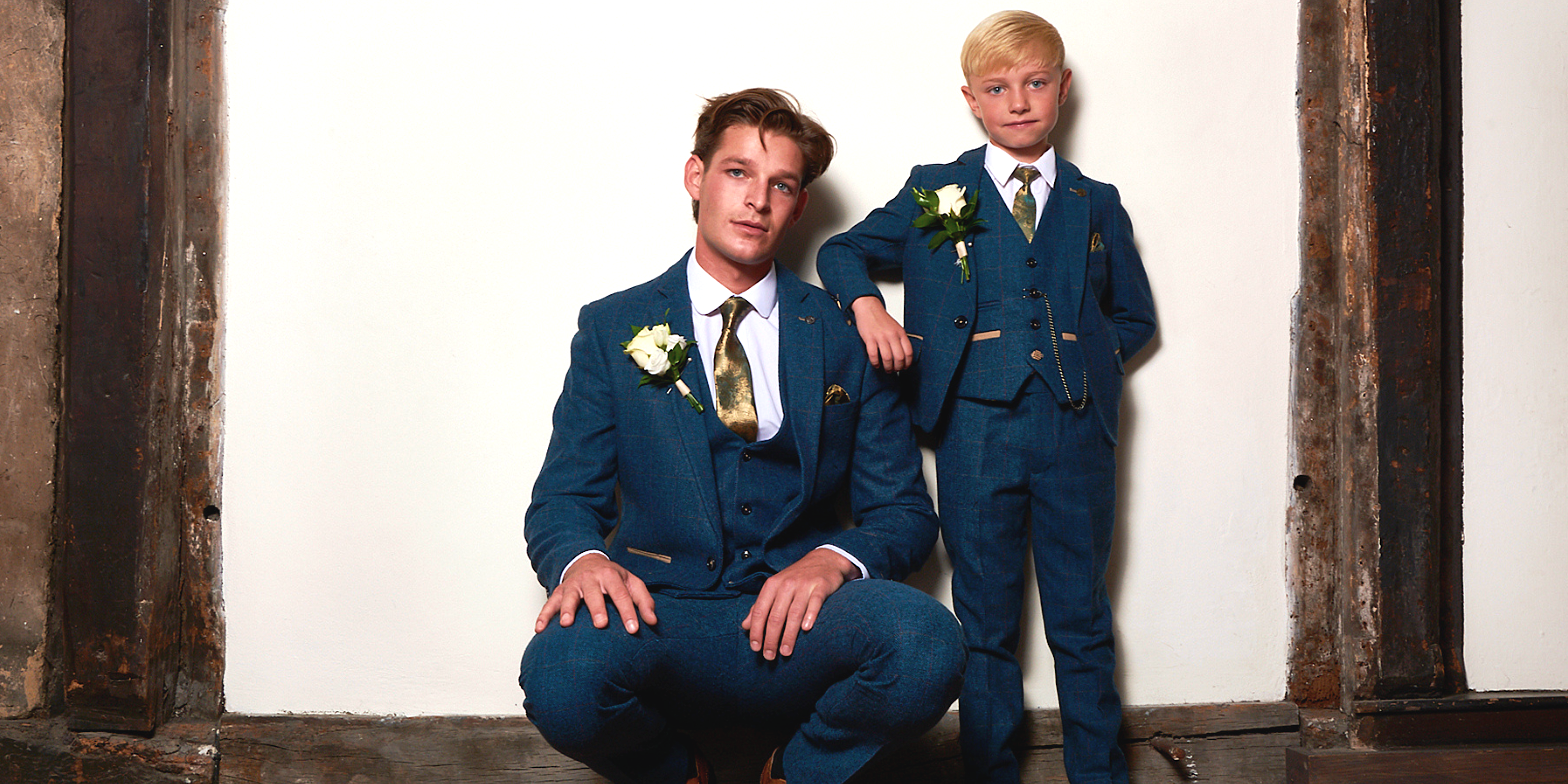 father and son wearing matching blue tweed wedding suits