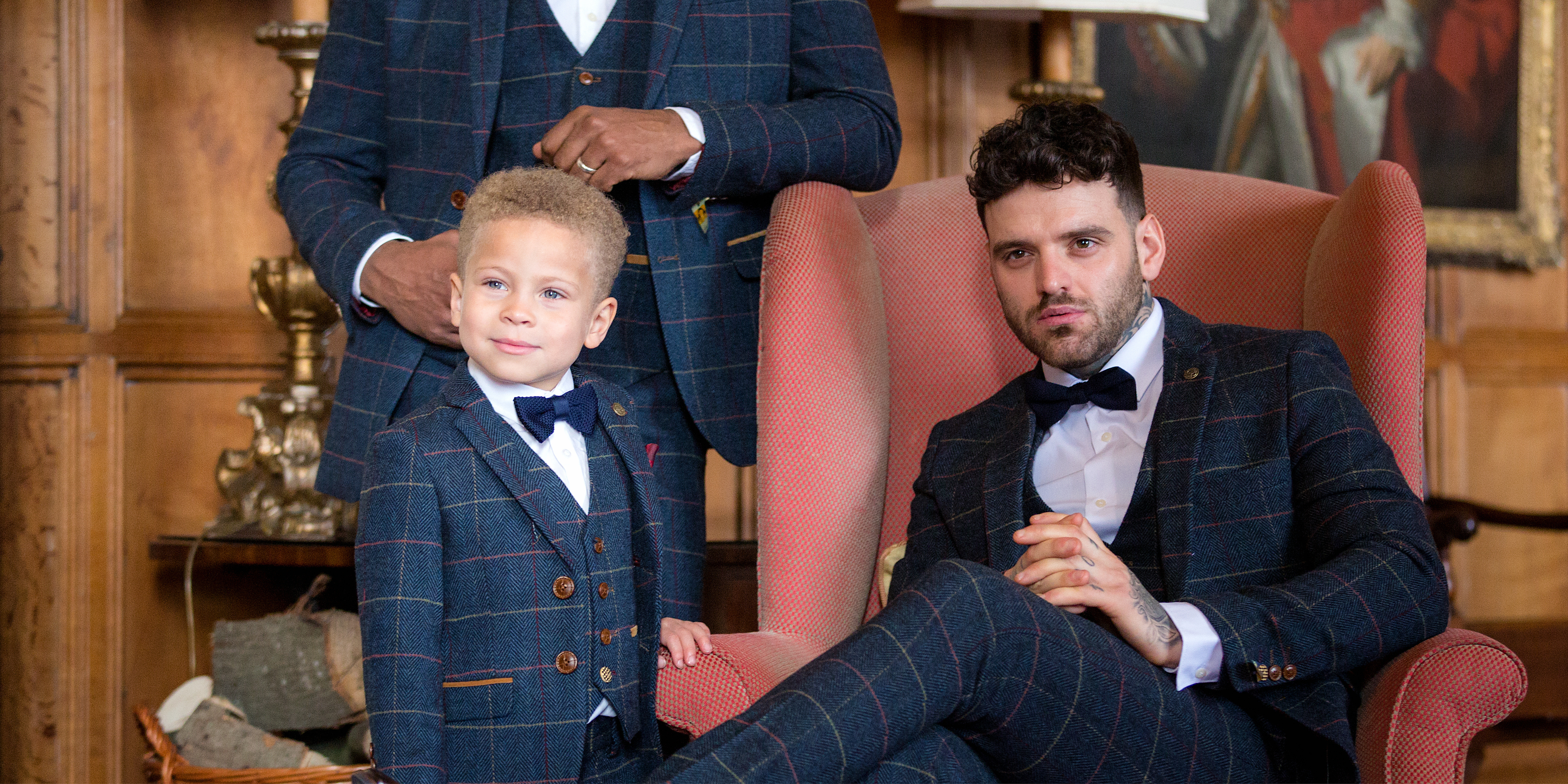 child wearing boys bow tie and boys tweed suit