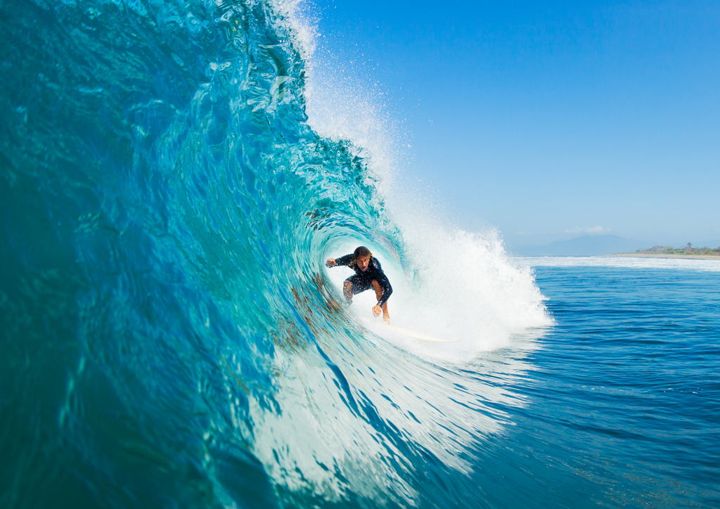 man surfing awesome wave