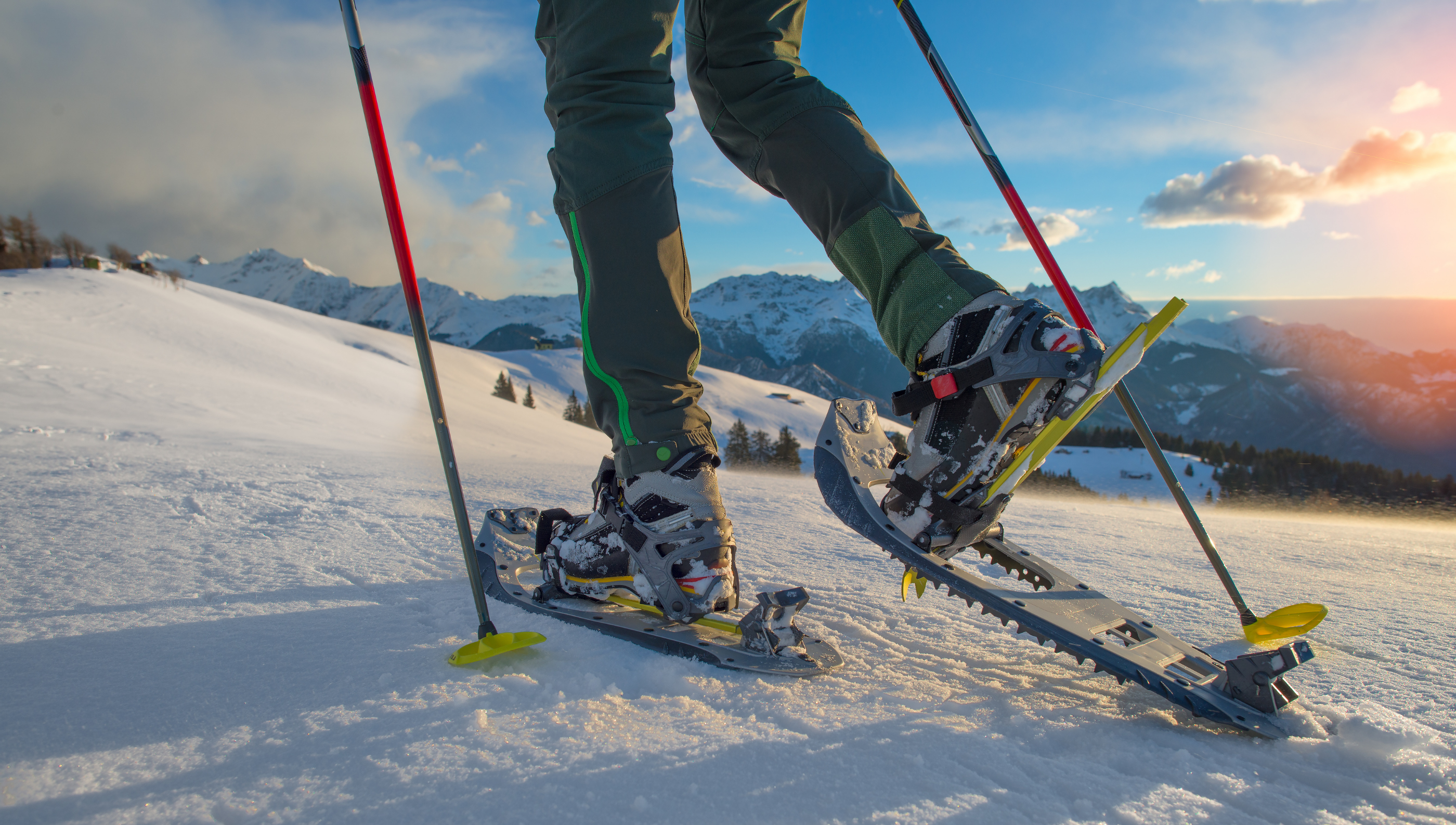 hiker with snowshoes walking