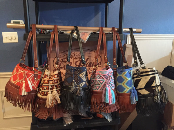 Leather and twill bucket bags with leather fringe