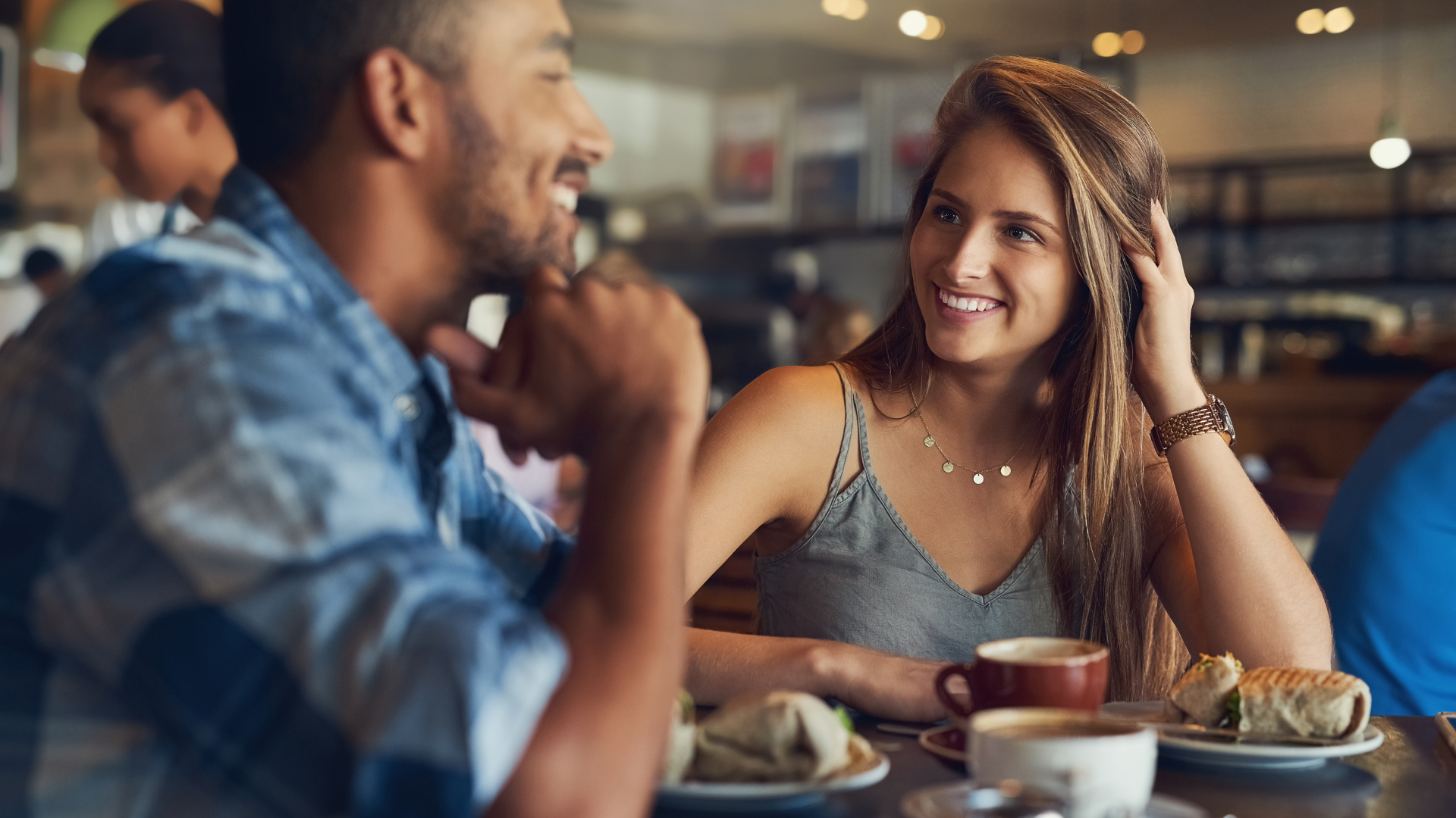 Couple in a Cafe stock. Dating first impressions.