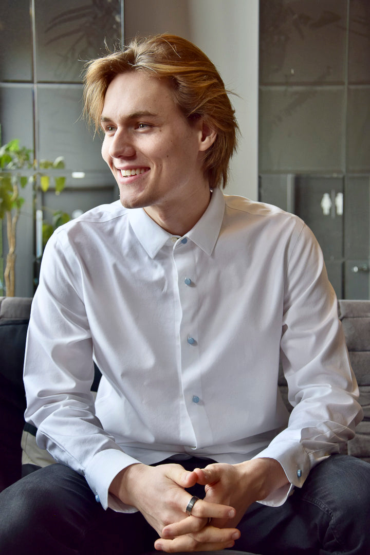 A young man in a white shirt