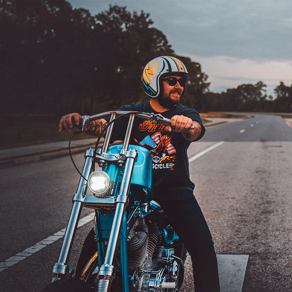 Motorcycle rider wearing Daytona Helmets Cruiser helmet with lightning desgin