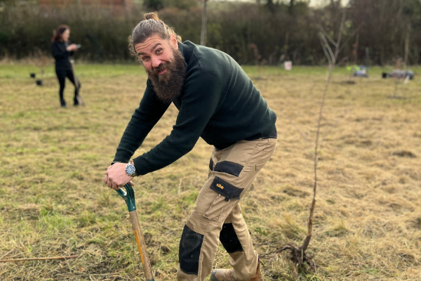 Richard planting a tree