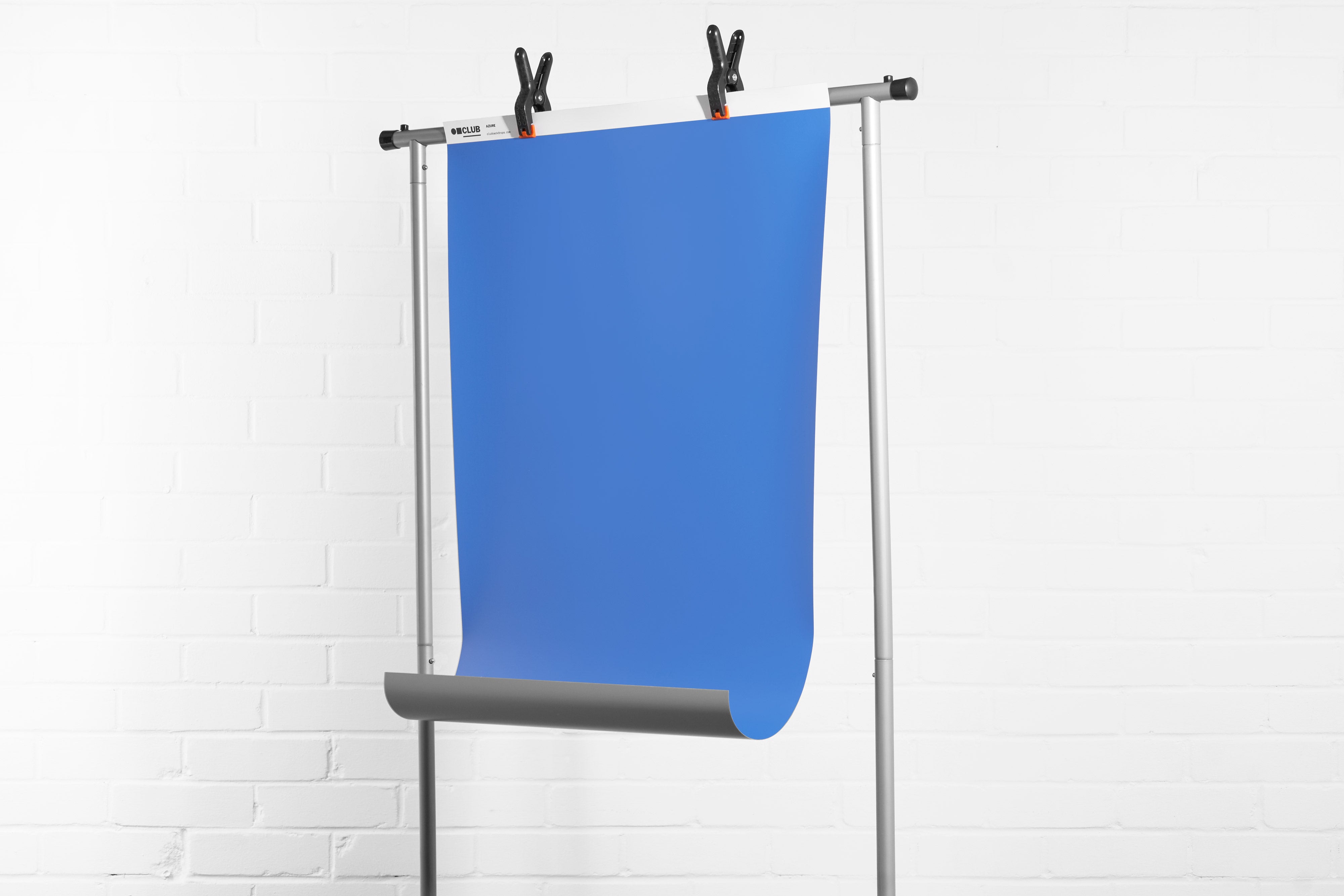 Hang vinyl backdrops from a clothing rail and the curve will drop out 