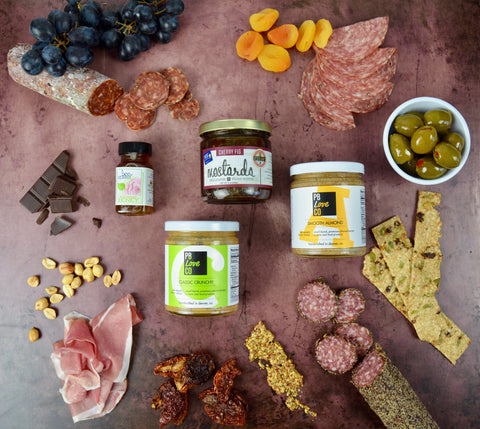 All-natural peanut butter and almond butter. Charcuterie board for mother's day. Party favorites for Mother's Day 2022. Cured meats, cheeses, dried fruit, fresh fruit.