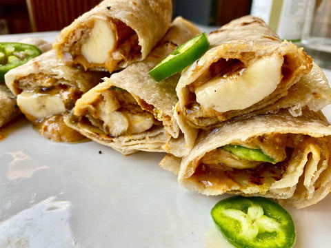 Mario wrapping a spicy wrap with tequila jalapeno preserve and Salty Peanut butter. 