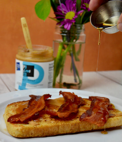 Brunch toast for Mother's Day 2022. All-natural peanut butter and almond butter with toast. French toast with all-natural peanut butter and almond butter. French toast with bacon and maple syrup.