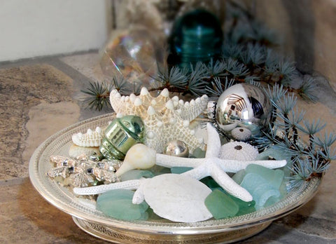 silver tray with shells and sea glass