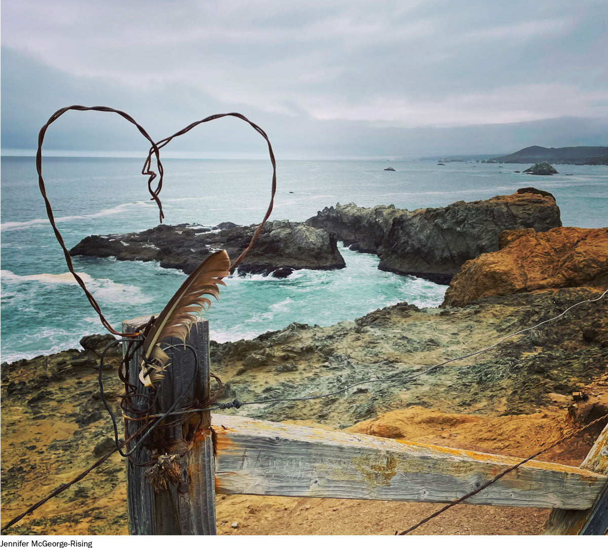 barbed wire heart overlooking the ocean