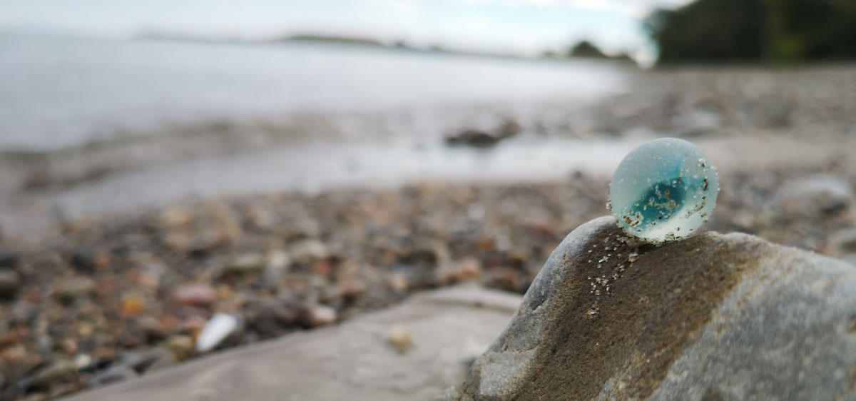 sea glass marble at the beach