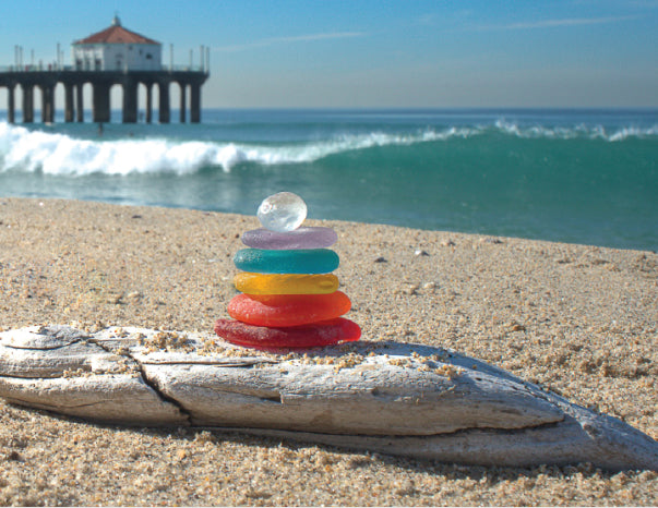 sea glass stack next to california beach pier