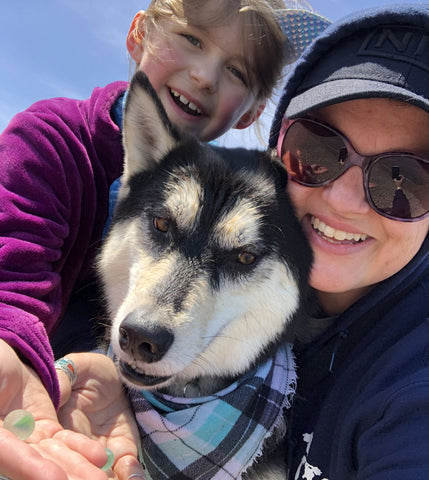 collecting beach glass with husky